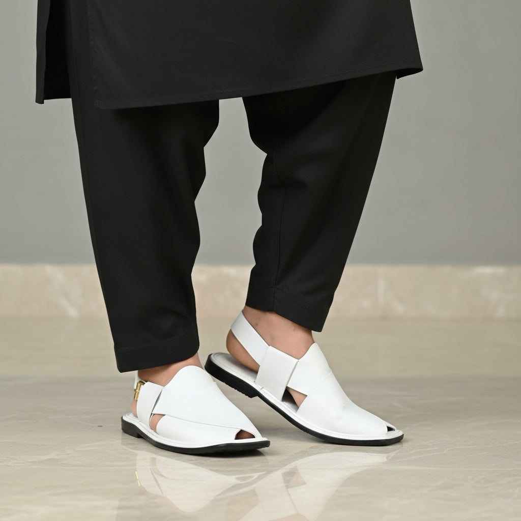 White sandals worn by model on a neutral background