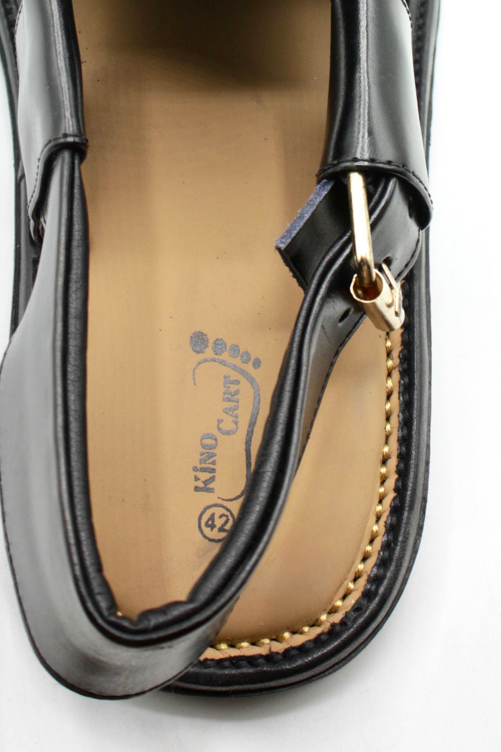 Close-up of a black Peshawari shoes with a gold Stitching  on a white background