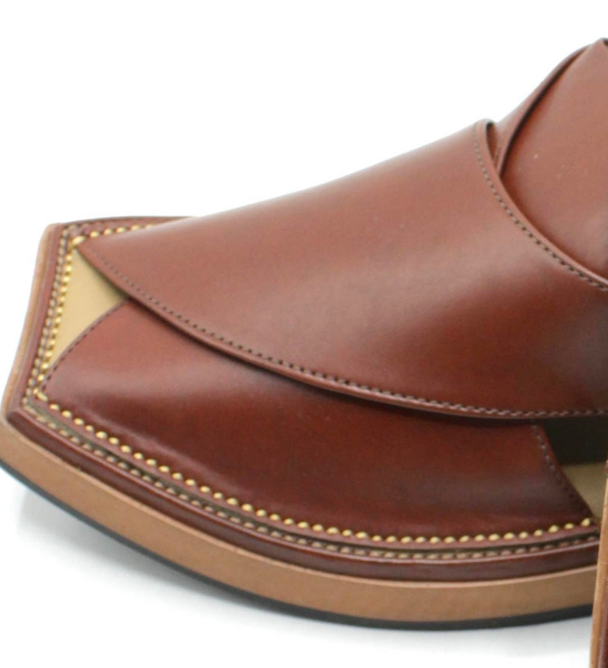 Close up of Brown leather kaptan Peshawarai shoes with gold stitching on a white background