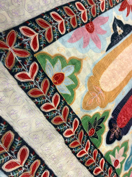 Close-up of a colorful quilt with floral patterns Kalamkari shawl
